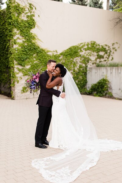 couple posing for wedding portraits at the Kauffman in Kansas City