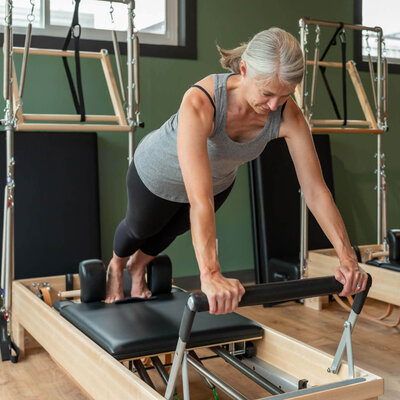Sharon practicing long stretch on the reformer