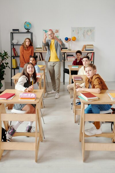 grad school choldren in classroom with male teacher