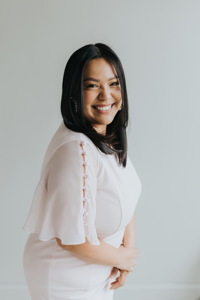 Wedding Planner Cynthia smiling in a black blouse