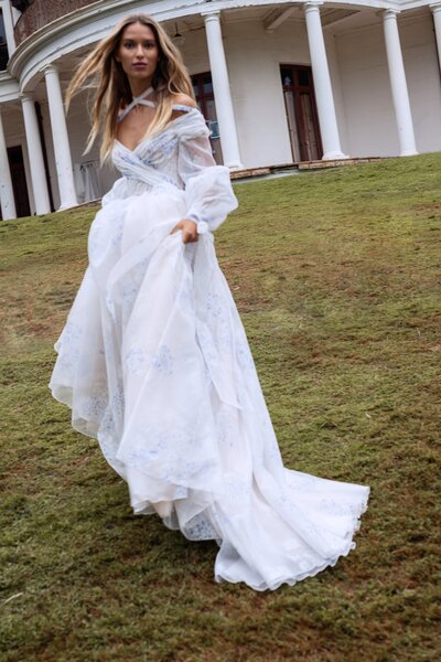 black and white image bride wearing  long sleeve lace wedding dress