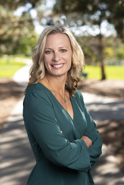 Dr. Nicole Dorotik MD headshot in green blouse