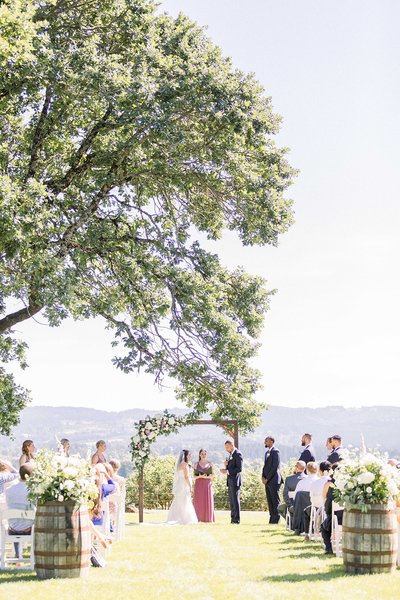 summer scholls wedding ceremony by Oregon Photographer Kelby Maria