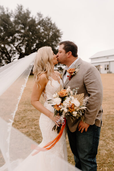 bride and groom kissing