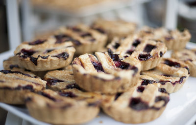 Several hand-sized berry pies.