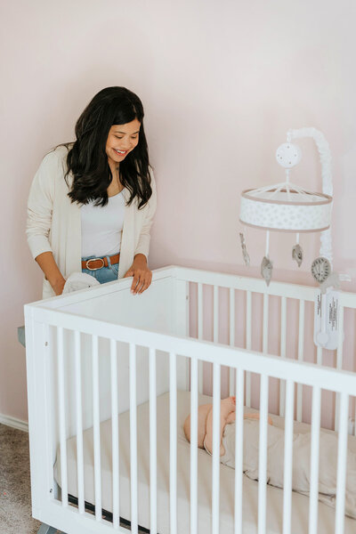 Cristina Pilcher, Certified Sleep Consultant in Dallas-Fort Worth, Tx helping put baby to bed