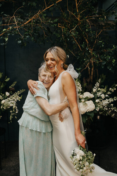 bride and grandma hugging after the Melbourne wedding ceremony at Rupert on Ruper in Collingwood