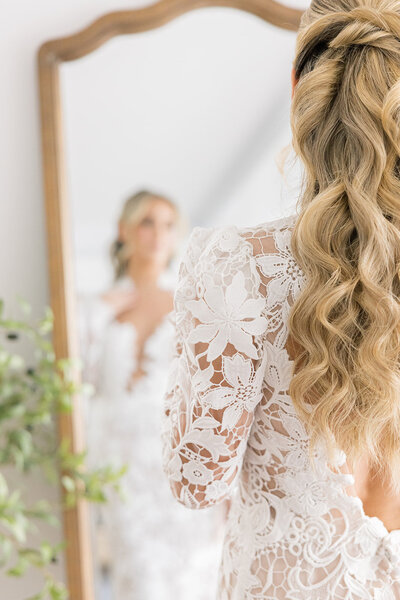 Bride looking in mirror
