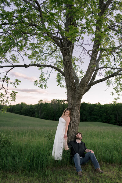 An outdoor couples session in Wantage NJ, blending candid smiles with beautiful evening light for authentic portraits.