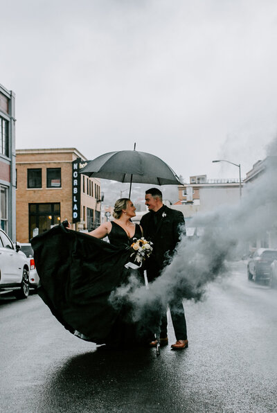 Norblad Hotel | The Ruins at the Astor in Astoria Oregon Coast Wedding. Black Wedding Dress Smoke Bomb  Umbrella
