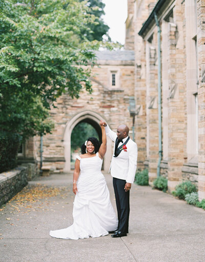 Bride and groom sneak away for a private moment during their wedding reception