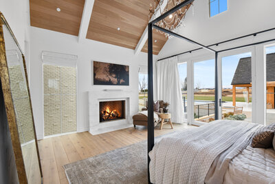 Luxury primary bedroom design by Idaho Luxury Custom Home builder Thompson Homes