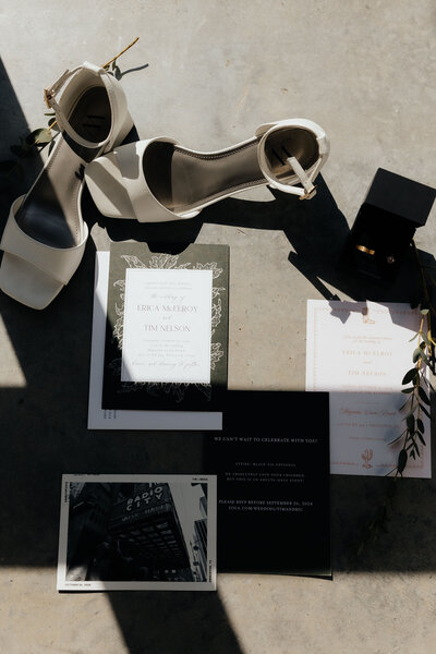 flat lay of brides shoes and invitations at wedding venue in texas