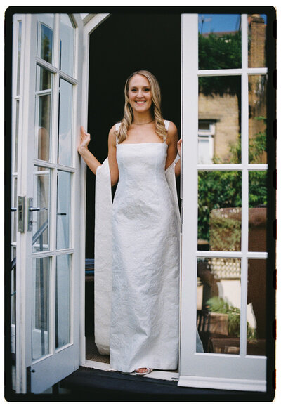 Wedding photographer captures couple taking a stroll hand in hand at their french chateau wedding.