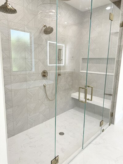 Home renovation portfolio in Frisco showcasing a bath project with elegant fixtures, modern materials, and a luxurious design.