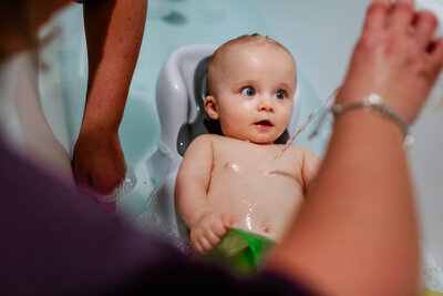 A baby taking a bath