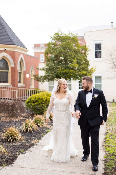 Bride and groom walking along at The Gatsby, Kentucky