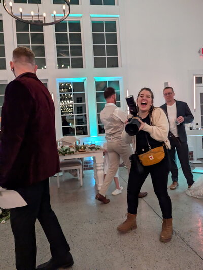Jamie Tobin Photography laughing during a wedding reception 