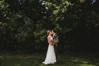 cowboy kisses bride on forehead