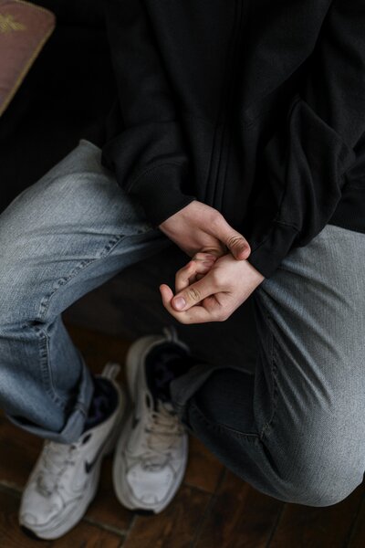 hands holding the cuff of sleeves