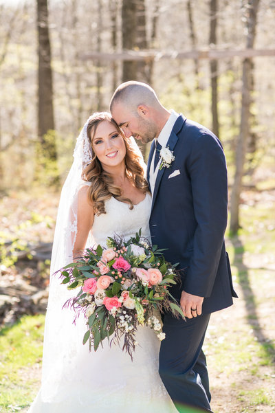 Bride and groom embrace outside at Rock Island Lake Club wedding