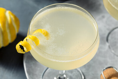 Spiral lemon twist garnish on a French 75