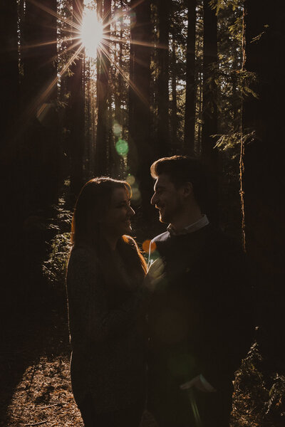 couple embracing in forest