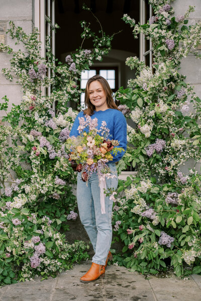 Jacci the florist hold a bouquet in Northern California.