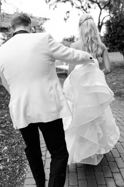 Bride hugging excited bridesmaids after ceremony