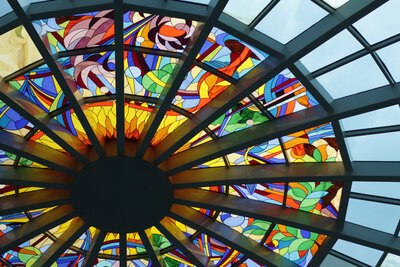 A section of colorful stained glass on a ceiling