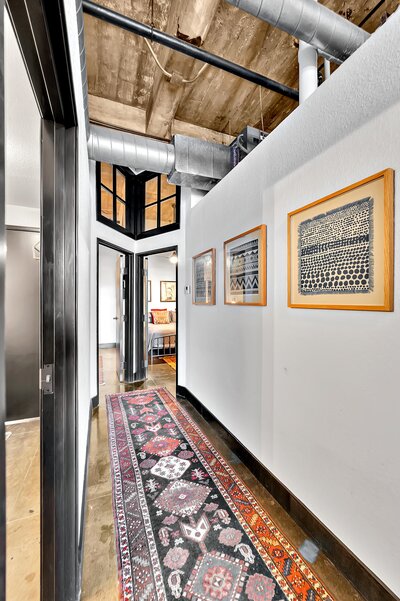 Entry way of the two-bedroom, two-bathroom vacation rental condo in the historic Behrens building in downtown Waco, TX just blocks from the Silos, Baylor University, and Spice Street.