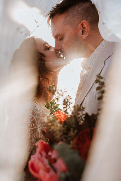 bride and groom kissing