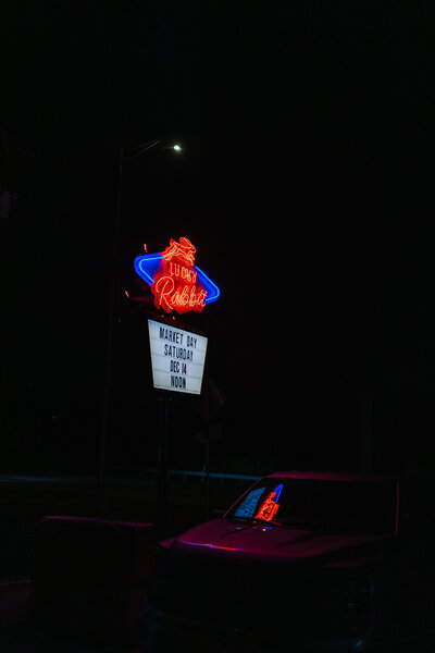 Bride and groom holding hands close up