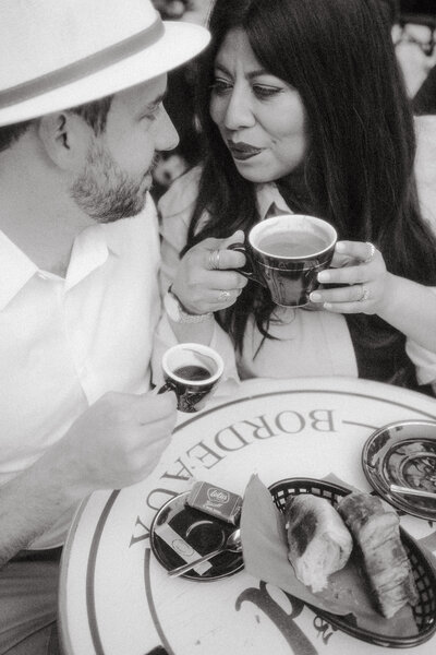 Black and white image of wedding portrait photographer and husband having coffee at Onyx in  NWA.