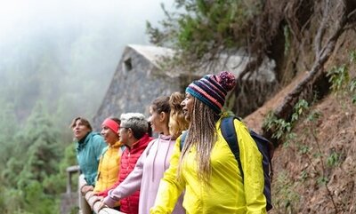 diverse group of women traveling together in Europe viewing the mountains