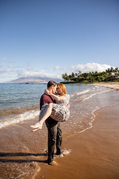Maui Wedding Photographer captures man lifting woman on beach