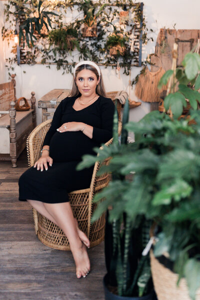 Bridemaids wearing classy black floor length dresses walk down a spiral staircase in Washington DC 