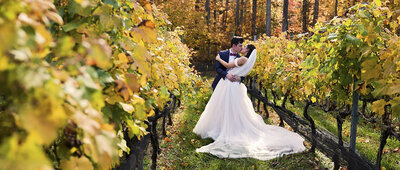 bride-and-groom-posing-in-orchard