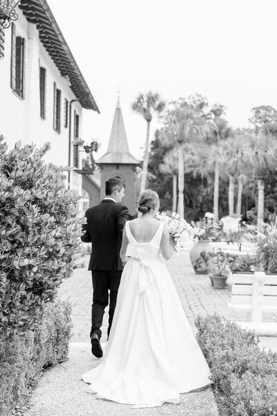bride and groom spend time in the garden at the jekyll island club