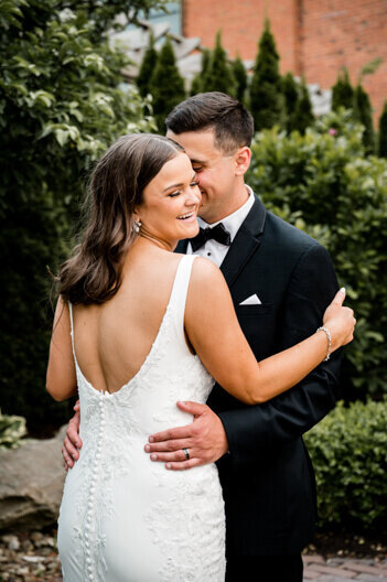 bride and groom laughing and hugging on cleveland wedding day