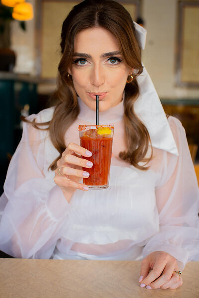 Bride drinking n London pub.  Exmouth market elopement 