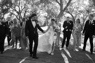 Austin-based wedding photographer captures a black and white photo of a wedding party.