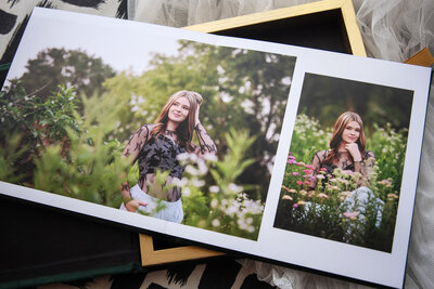 Newborn photo album open with heirloom box
