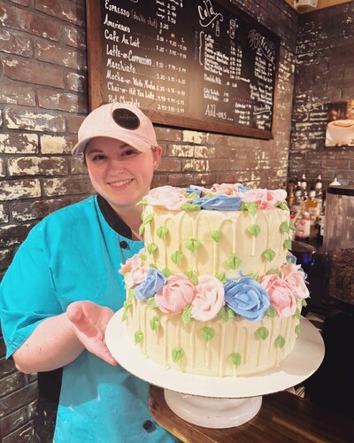 girl holding cake