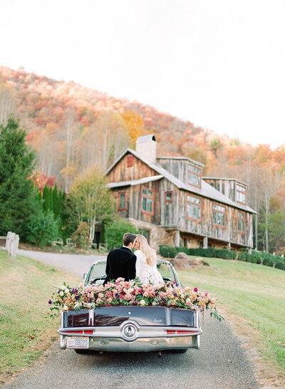 Couple in Back of Vintage Car Kissing Photo