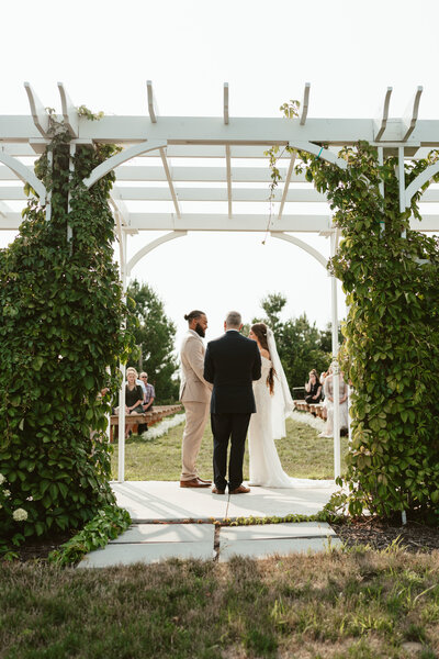 Couple gets married outside among a vineyard