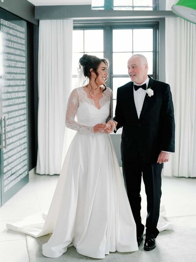 Bride and dad preparing to go down the aisle.