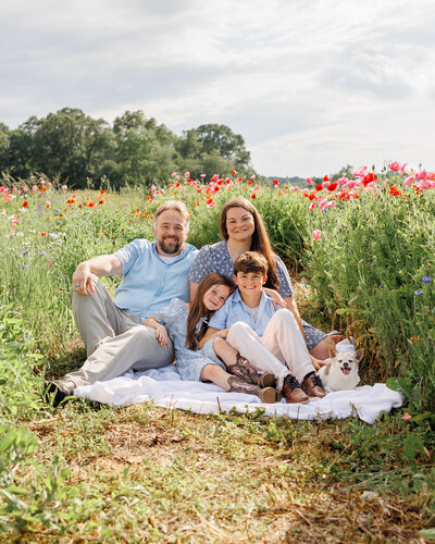 Portrait of family in a sunny flower field in Pennsylvania