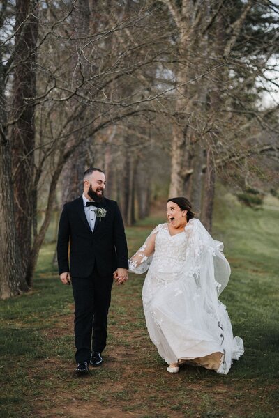 bride and groom walking and smiling