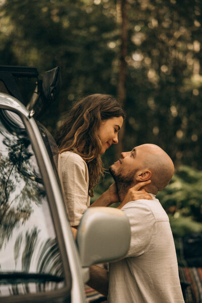 Cinematic van-life couples session in the Sunshine Coast Hinterland, capturing an intimate forest moment beside a camper van — nostalgic, emotive storytelling photography for adventurous lovers by Sunshine Coast Photographer